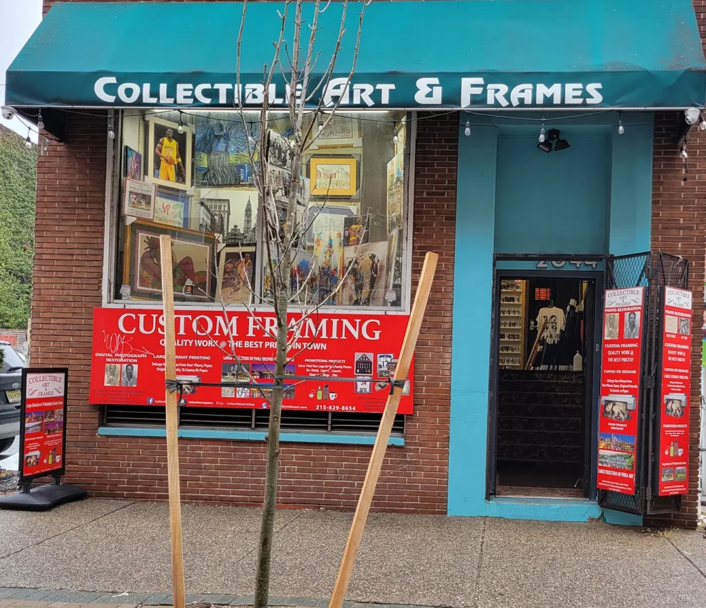 Storefront featuring a sign that reads "Collectable Art and Frames,